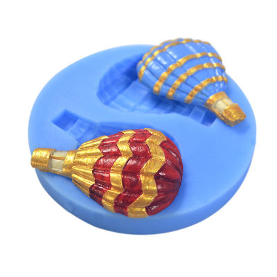 La torta de la pasta de azúcar del silicón que adorna equipa el balón de aire modificado para requisitos particulares formado